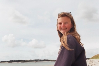 Sarita Whitehead sat on a beach